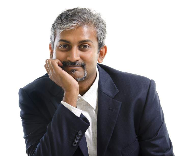 14010905 – mature indian businessman smiling, isolated white background